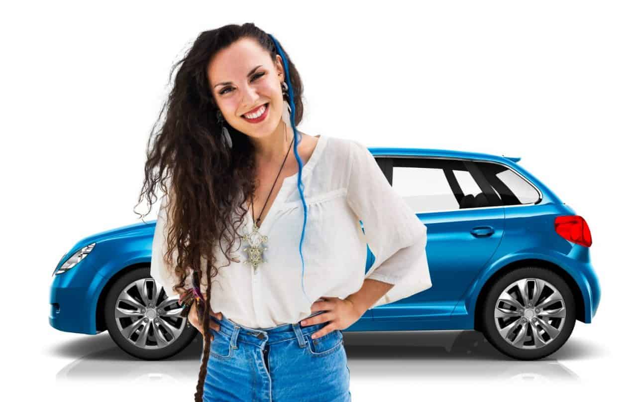 Photo of a woman that is smiling with a blue car in the background