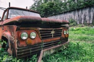 Junk car abbandoned in a proriety