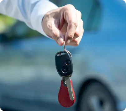 a hand holding a car key